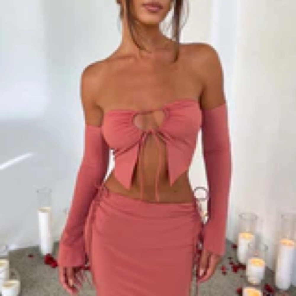 Beautiful rose-pink crop top, tiefront keyhole, attached flared sleeves.